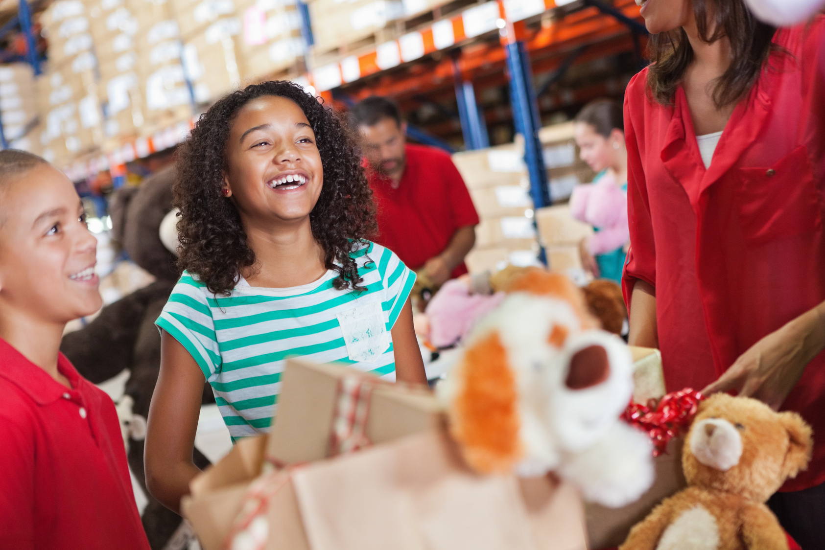 Adults and children donating toys at Christmas charity drive